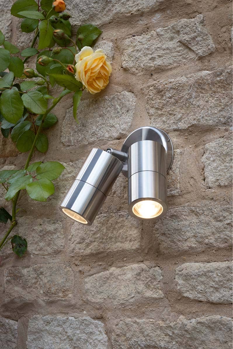 Ortega 2 Light Wall Light Aluminium on stone wall alongside orange climbing rose